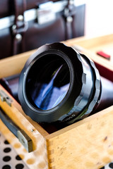Projector lenses in a wooden box