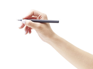 female's hand holding a pen