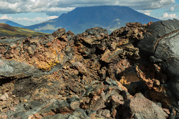 Obraz premium Lava field at Tolbachik volcano, after eruption in 2012 on background Big Udina volcano, Kamchatka