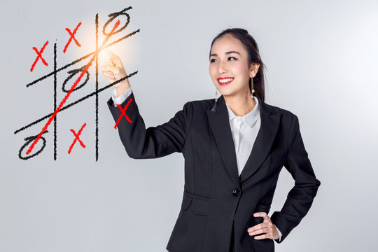 business asian woman is playing tic tac toe  business concept