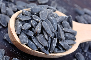 Wooden spoon with black sunflower