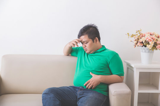 obese man thinking about his weight problem