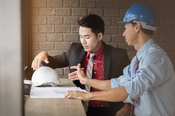 business man consult meeting with engineer or architect with cafe background