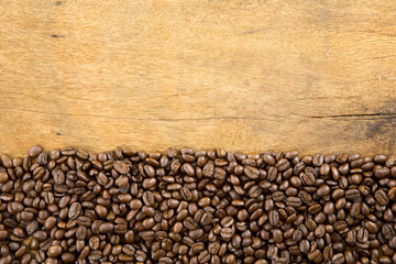 Coffee beans on wood background