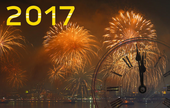 Happy New Year 2017, Firework and Vintage clock at midnight.