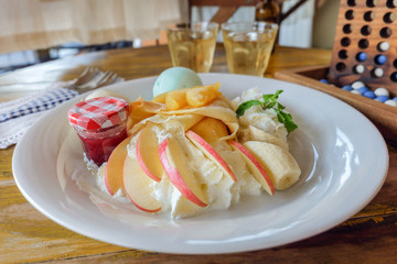 crepe with fresh fruit  on wooden table