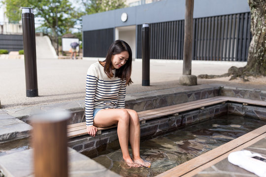 Woman enjoy foot onsen
