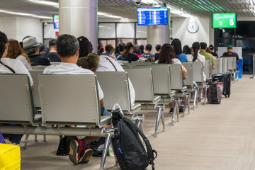 Passengers waiting the airplance arrive at the seat in the airport. transportation concept