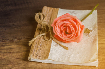 Beautiful rose and vintage diary.