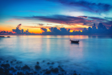 Calm sunrise over ocean on Maldives