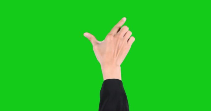 Video footage of businessman hand touching and zooms virtual touchscreen with green screen background
