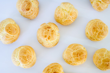 Homemade cake, Homemade eclairs on white background at house. Traditional French dessert. top-view
