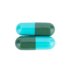 Two capsule color green and blue isolated on white background