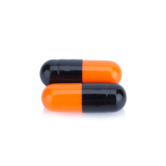 Two capsule color Black and Orange isolated on white background