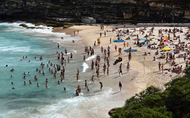 Sydney, Australia - Feb 5, 2017. People relaxing, swimming and sun bathing on Tamarama beach.