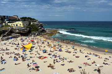 Sydney, Australia - Feb 5, 2017. People relaxing, swimming and sun bathing on Tamarama beach.