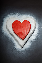 Holidays gift and heart on a black background. Valentines day