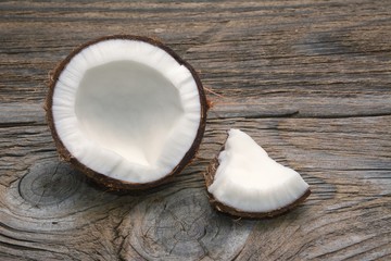 Obraz na płótnie Canvas Coconut on wooden table