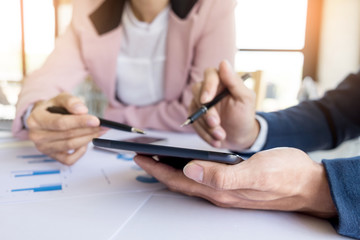 Team work process. young business managers crew working with new startup project. labtop on wood table, typing keyboard, texting message, analyse graph plans.