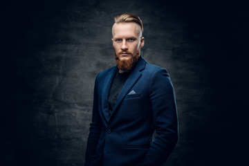 Fototapeta premium Redhead hipster male dressed in a blue jacket.