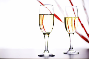 glass of white wine on a table on white background isolate