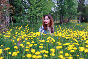 young woman on dandelion meadow