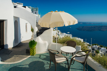 Architecture of  island of Santorini, the most romantic island in the world, Greece. Hotels in Santorini. Walking the streets of Fira summer day, Travel to Greece. Beautiful white exterior Santorini