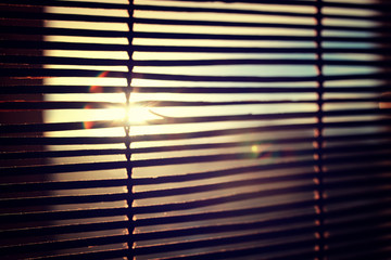 sun shining through the blinds