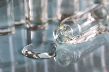 transparent vials of medicine