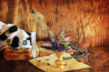 Fototapeta premium retro scratched effect concept arabian faith with book and flower