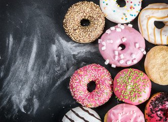 glazed donuts with different fillings on a black background