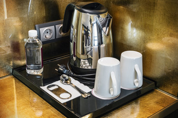 tea and coffee for a hotel room at the self-service table.
