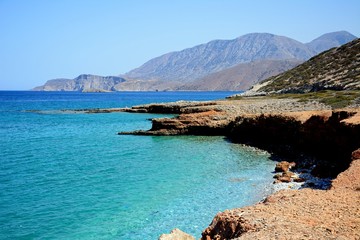 View of the beach and rugged coastline near Ammoudara, Crete.
