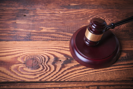 judge's gavel on old fir wood background