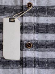 Coat Striped black and white with a price tag