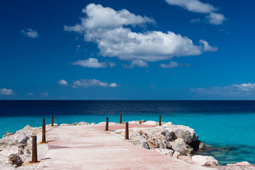 Tropical paradise - pier and blue ocean, sunny day and blue sky, nobody, wallpaper background