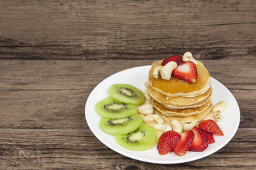 Pancake with strawberry and kiwi, delicious dessert