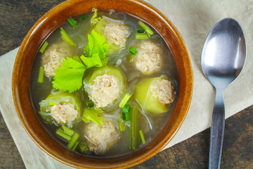 clear soup with cucumber, chicken and celery