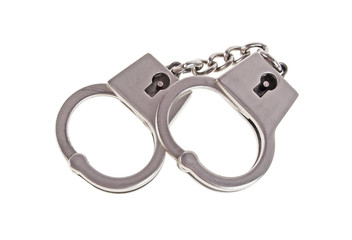 Silver handcuffs on white background
