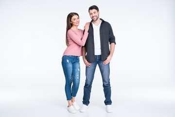 Obraz premium Full length view of happy young couple standing together on white