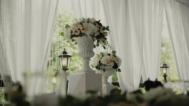 Wedding details. Beautiful flowers decration. Flowers composition. Sliding camera