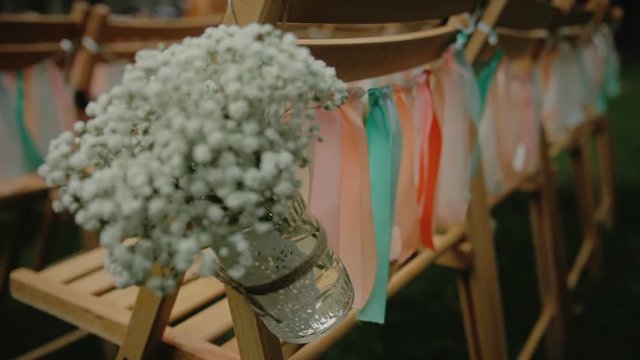 Wedding details. Beautiful flowers decration. Flowers composition. Sliding camera.