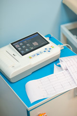 Fototapeta na wymiar Electrocardiogram, cardiac cardiograph and conduct research in pediatrics, a girl doing an electrocardiogram