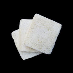 three pieces of gluten free white bread isolated on black