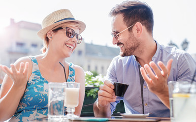 Romantic loving couple drinking coffee, having a date in the cafe. Dating, love, relationships