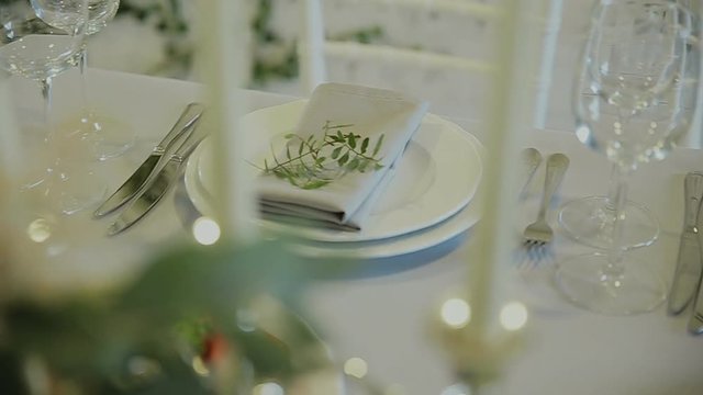 Wedding details. Beautiful flowers decration. Floral composition.Candles on the decorated table.