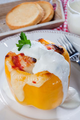 Yellow stuffed pepper with chicken meat dressing with cream