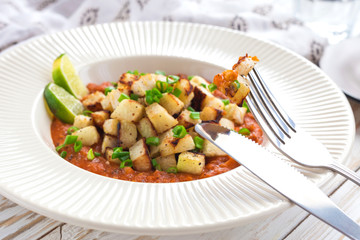 Stewed kohlrabi cabbage with lime and tomato sause