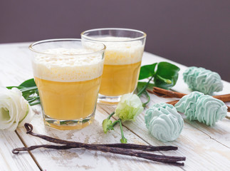 Eggnog, marshmallow dessert and white eustoma flowers. Easter concept