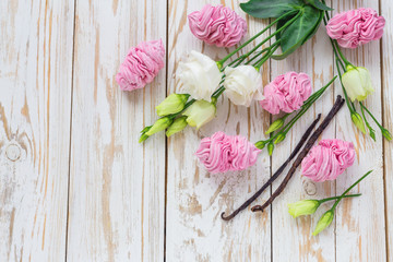 Homemade marshmallow dessert, vanilla sticks and white eustoma flowers.